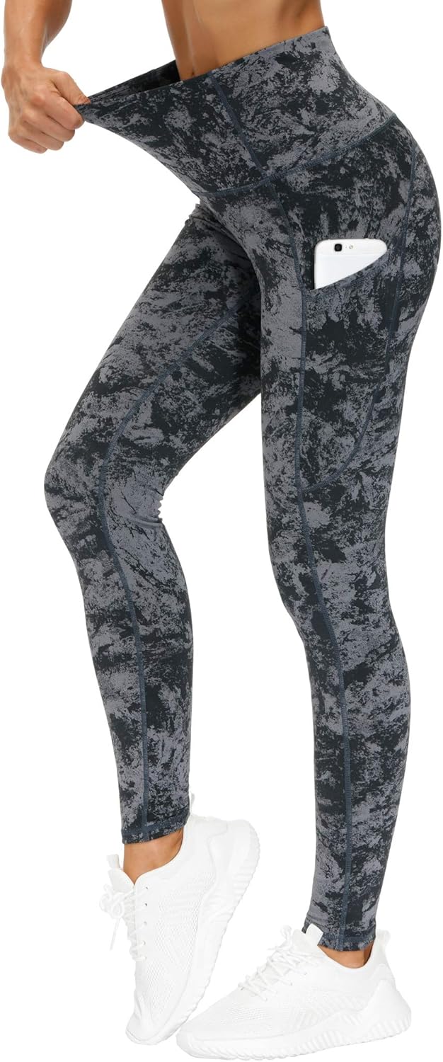 Black high-waisted yoga leggings with squat-proof compression fabric and side pockets — view 1