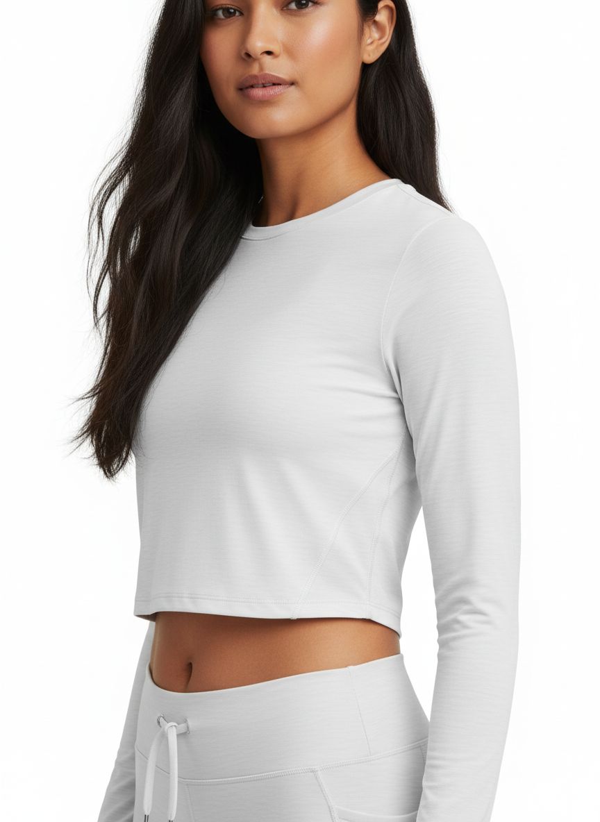 Women's fitted dry-fit crop top in {color} with moisture-wicking fabric, shown front view for running and gym workouts — view 4