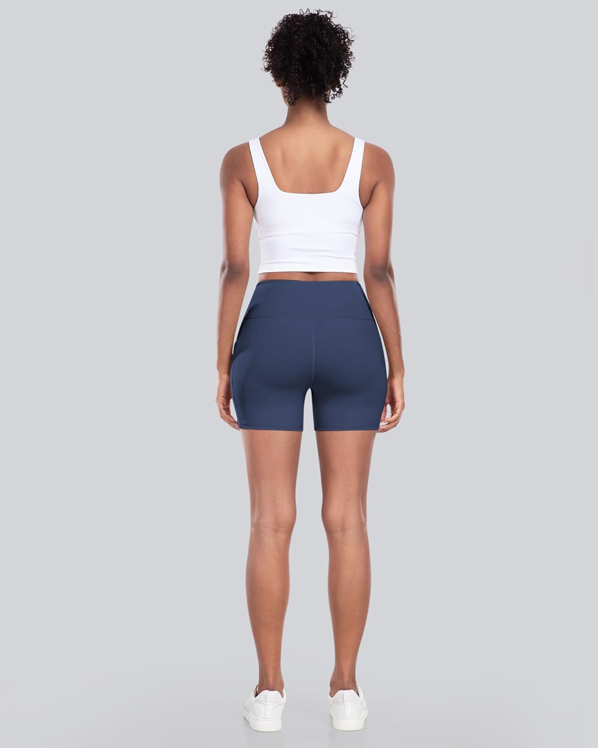 High-waisted biker yoga shorts in {color} with side pockets and squat-proof compression fabric — view 2