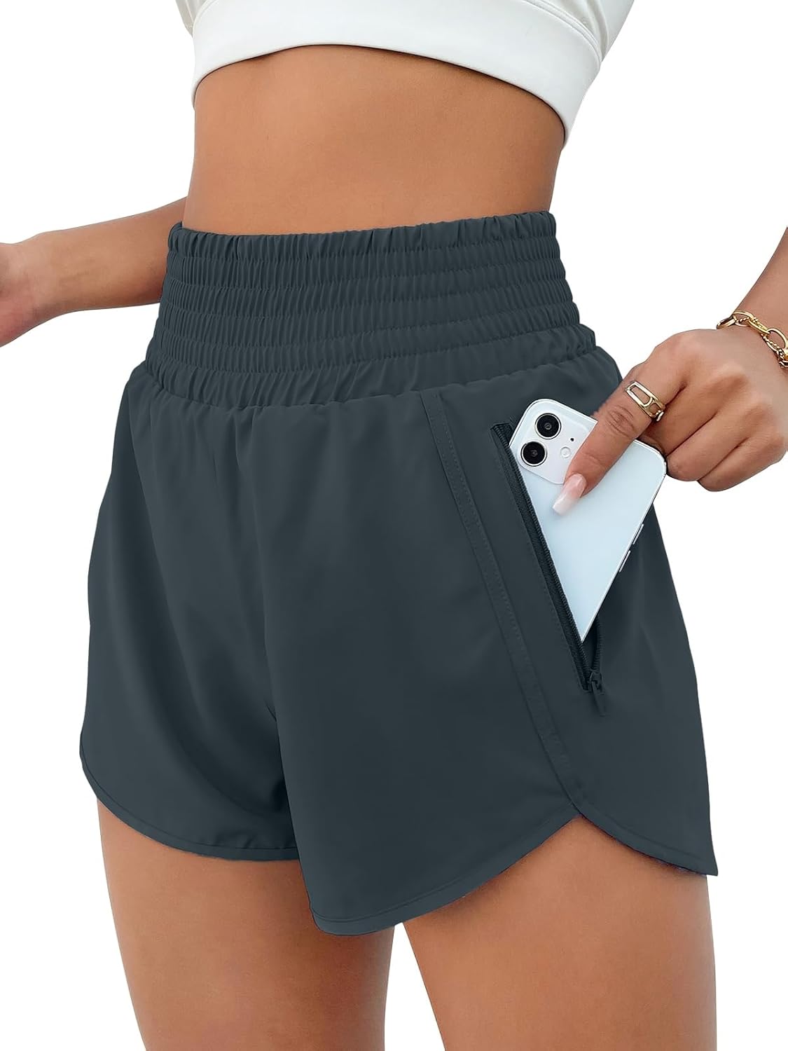 High-waisted black running shorts with side pockets and four-way stretch fabric — view 5