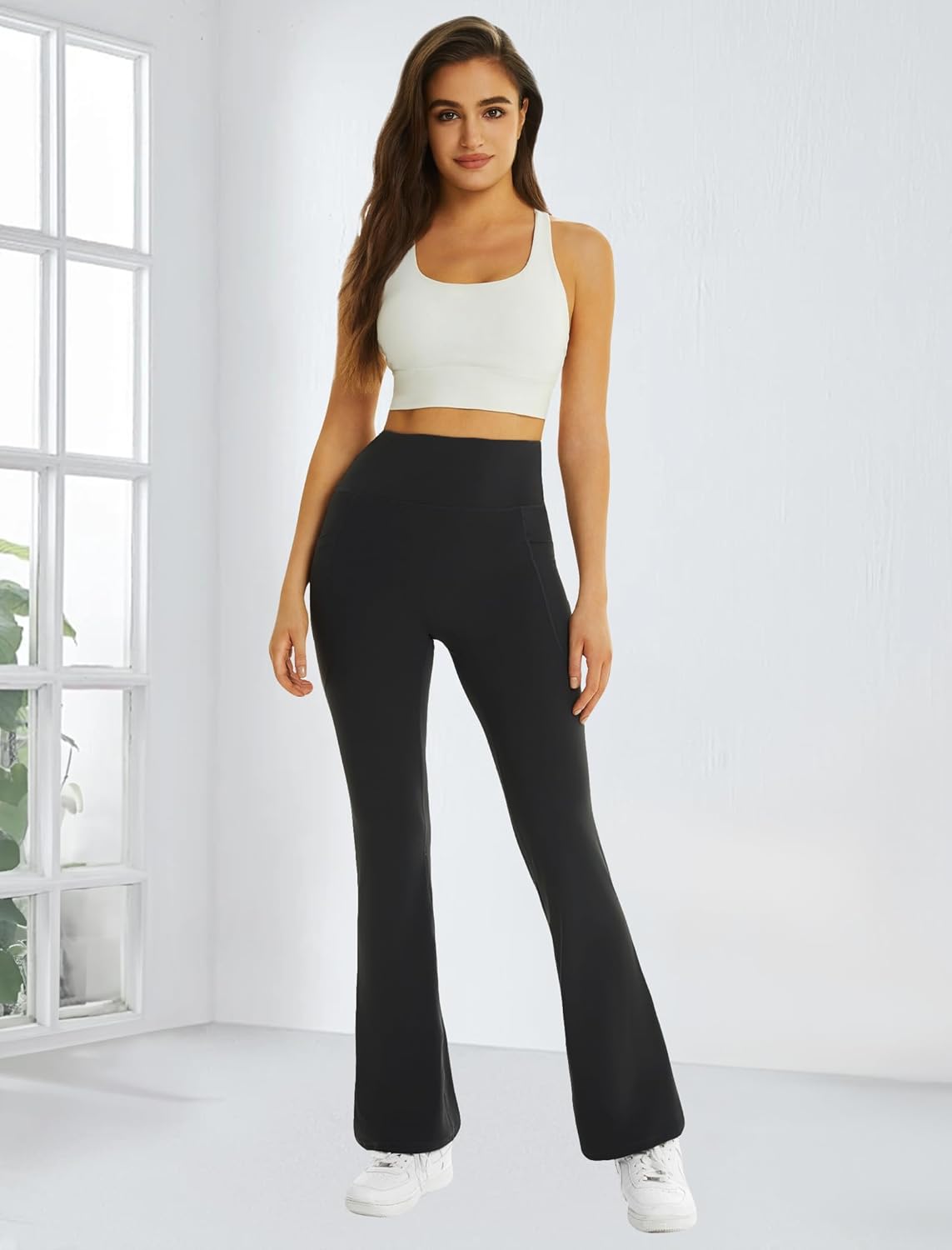 Black high-waisted flare yoga pants with pockets and tummy control — view 3