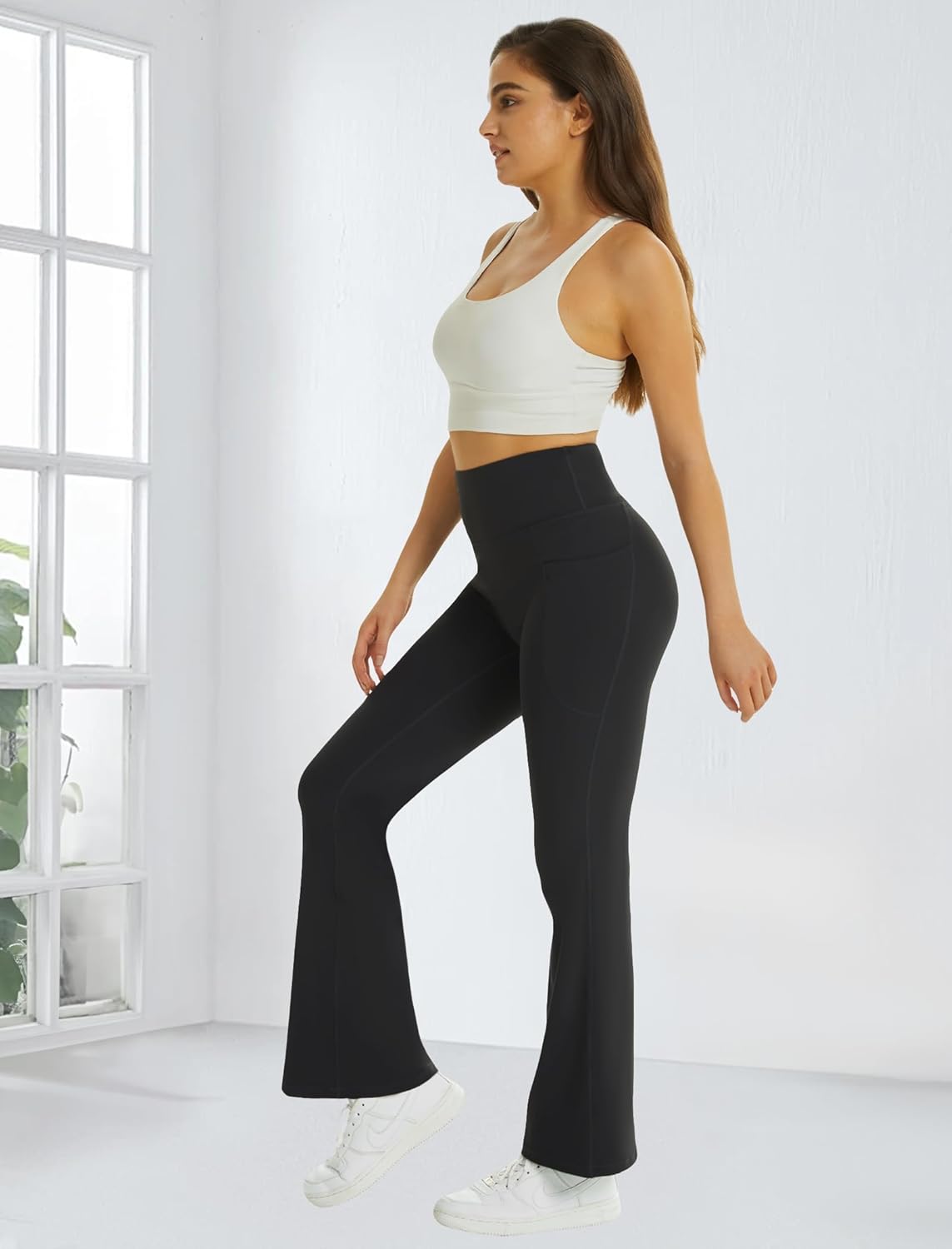 Black high-waisted flare yoga pants with pockets and tummy control — view 2