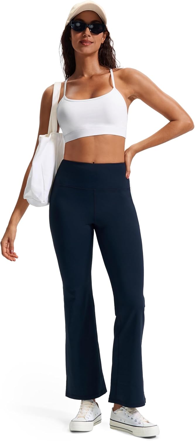 Black racerback sports bra with removable pads, front view showing moisture-wicking fabric โ view 2