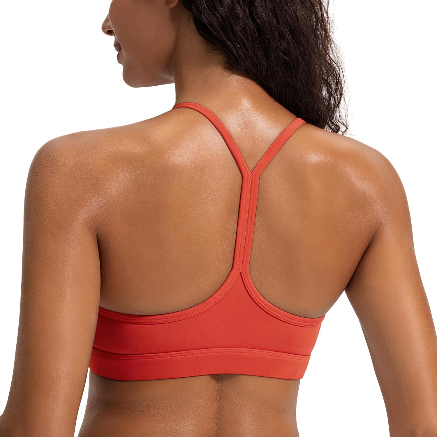 Black racerback sports bra with removable pads, front view showing moisture-wicking fabric โ view 4
