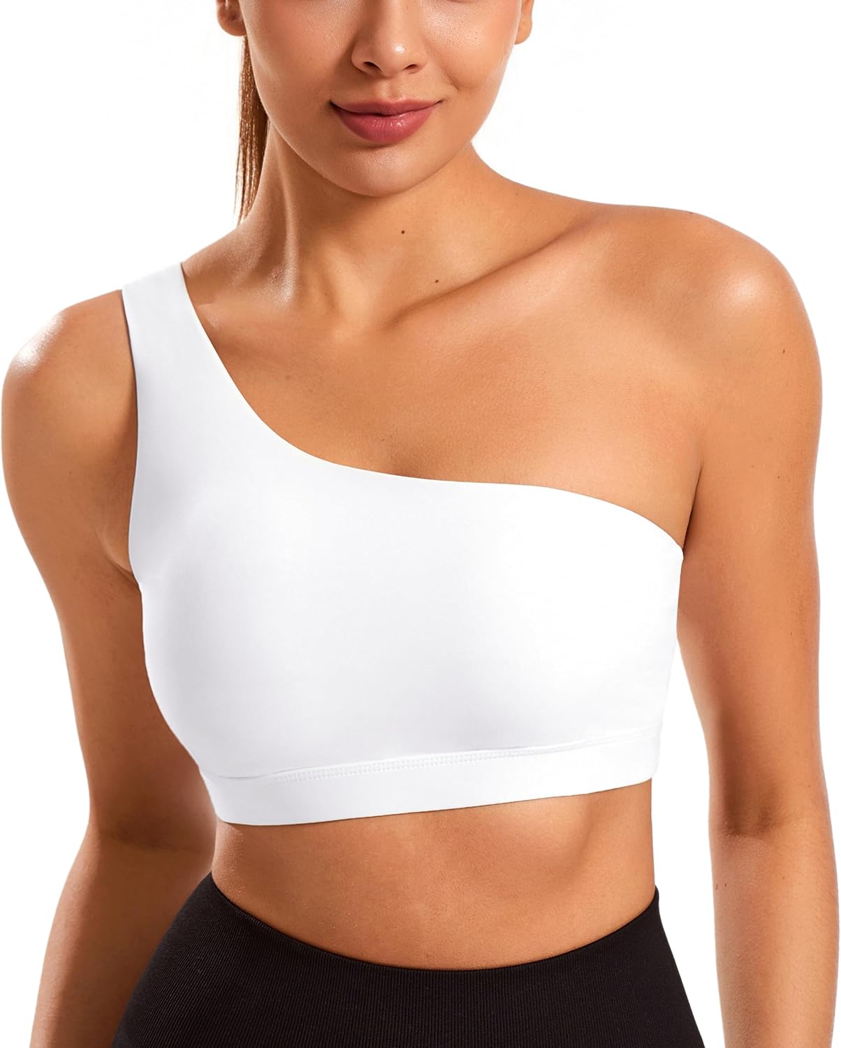 Black one-shoulder padded yoga bra with asymmetrical strap and four-way stretch fabric โ view 1