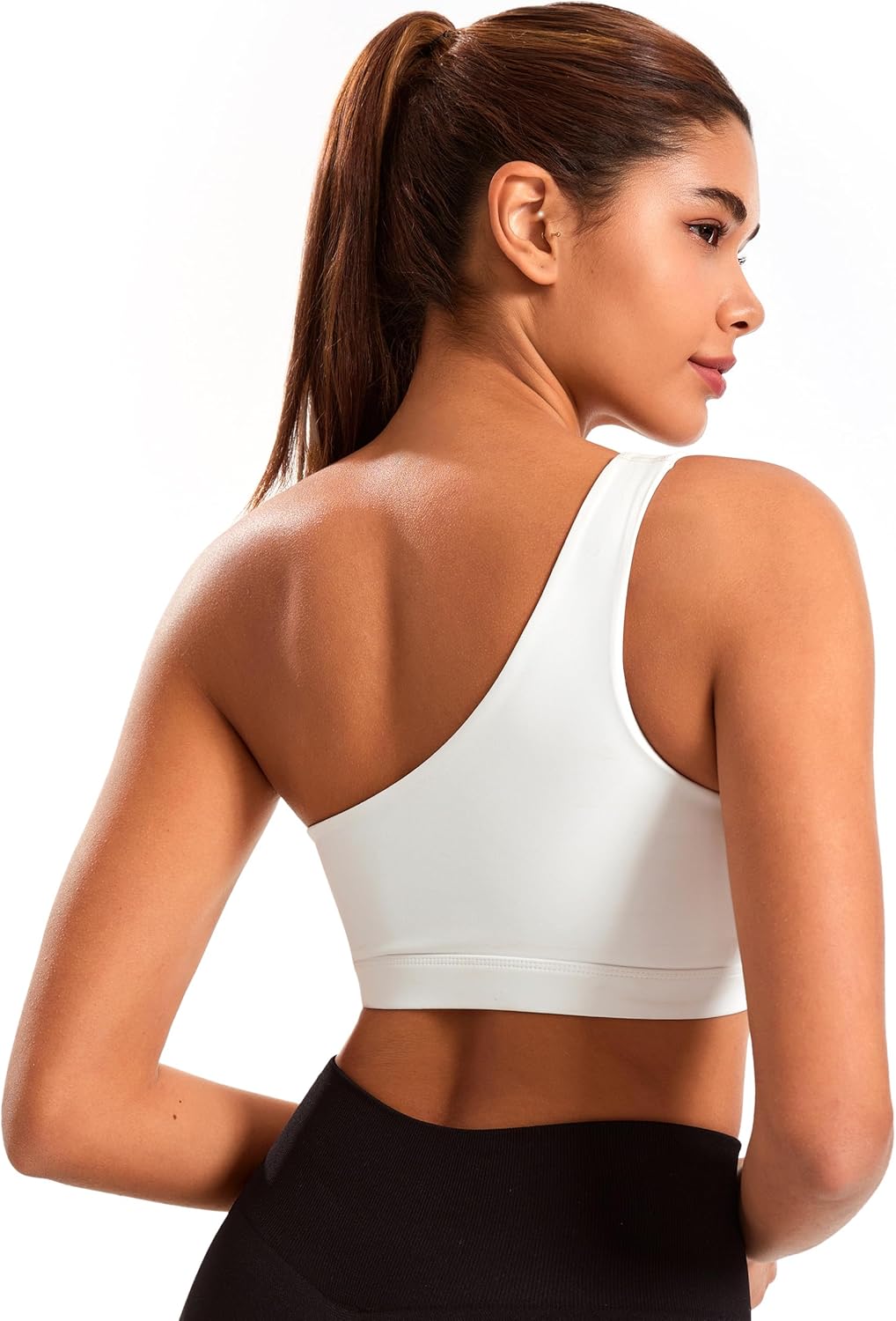 Black one-shoulder padded yoga bra with asymmetrical strap and four-way stretch fabric โ view 2