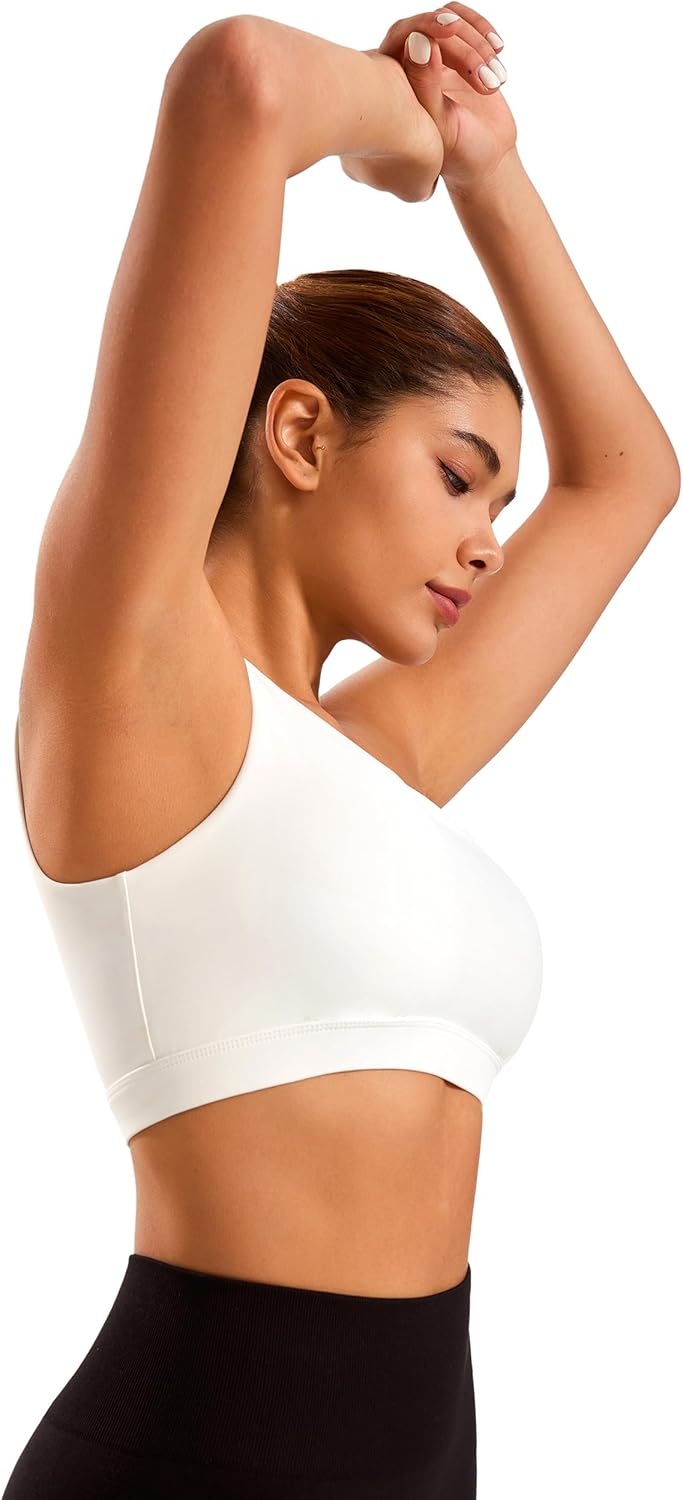 Black one-shoulder padded yoga bra with asymmetrical strap and four-way stretch fabric โ view 4