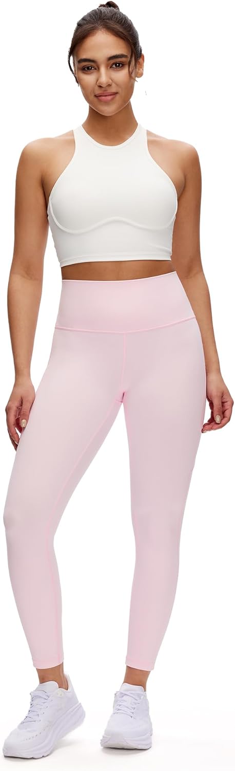 Black high-waisted yoga leggings with squat-proof fabric and side pockets, front and back view — side