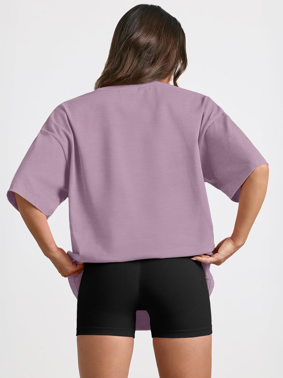 Oversized workout t-shirt in {color} with moisture-wicking fabric, displayed front view on model — view 2