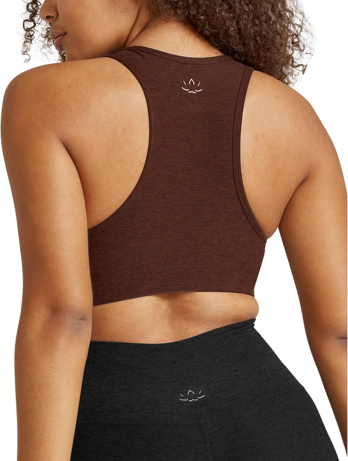 Spacedye multi-color yoga bra with fitted support, shown front view on model during yoga practice — view 2