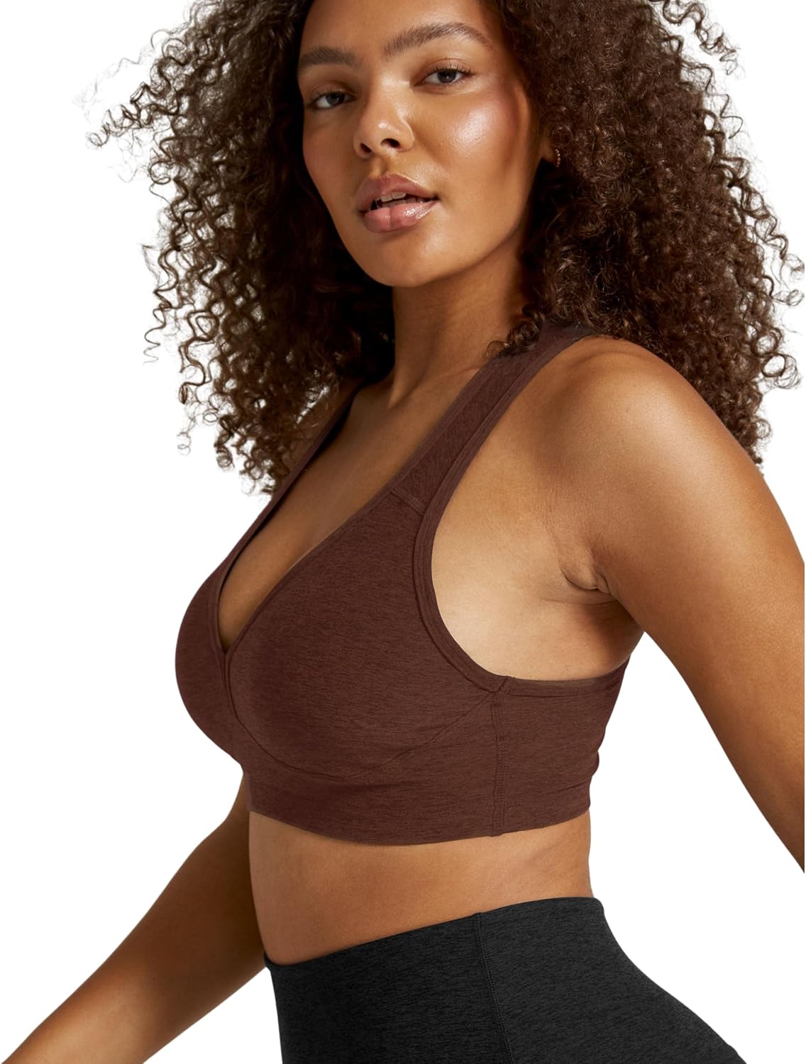 Spacedye multi-color yoga bra with fitted support, shown front view on model during yoga practice — view 3