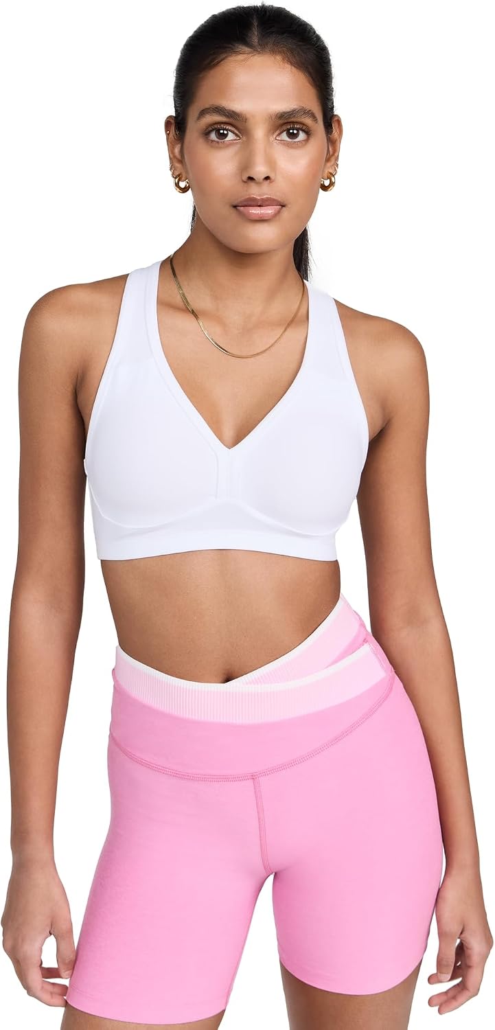 Spacedye multi-color yoga bra with fitted support, shown front view on model during yoga practice — view 2
