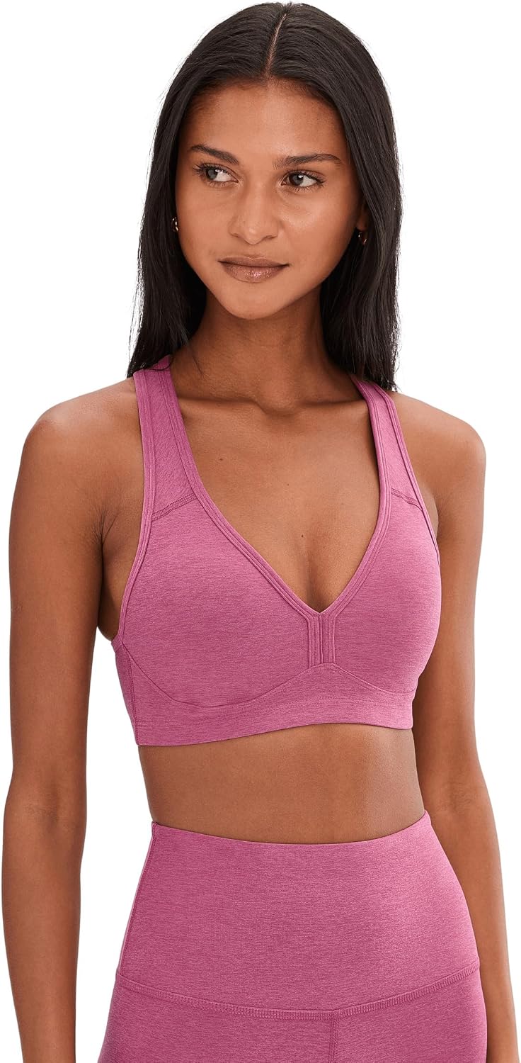 Spacedye multi-color yoga bra with fitted support, shown front view on model during yoga practice — view 3