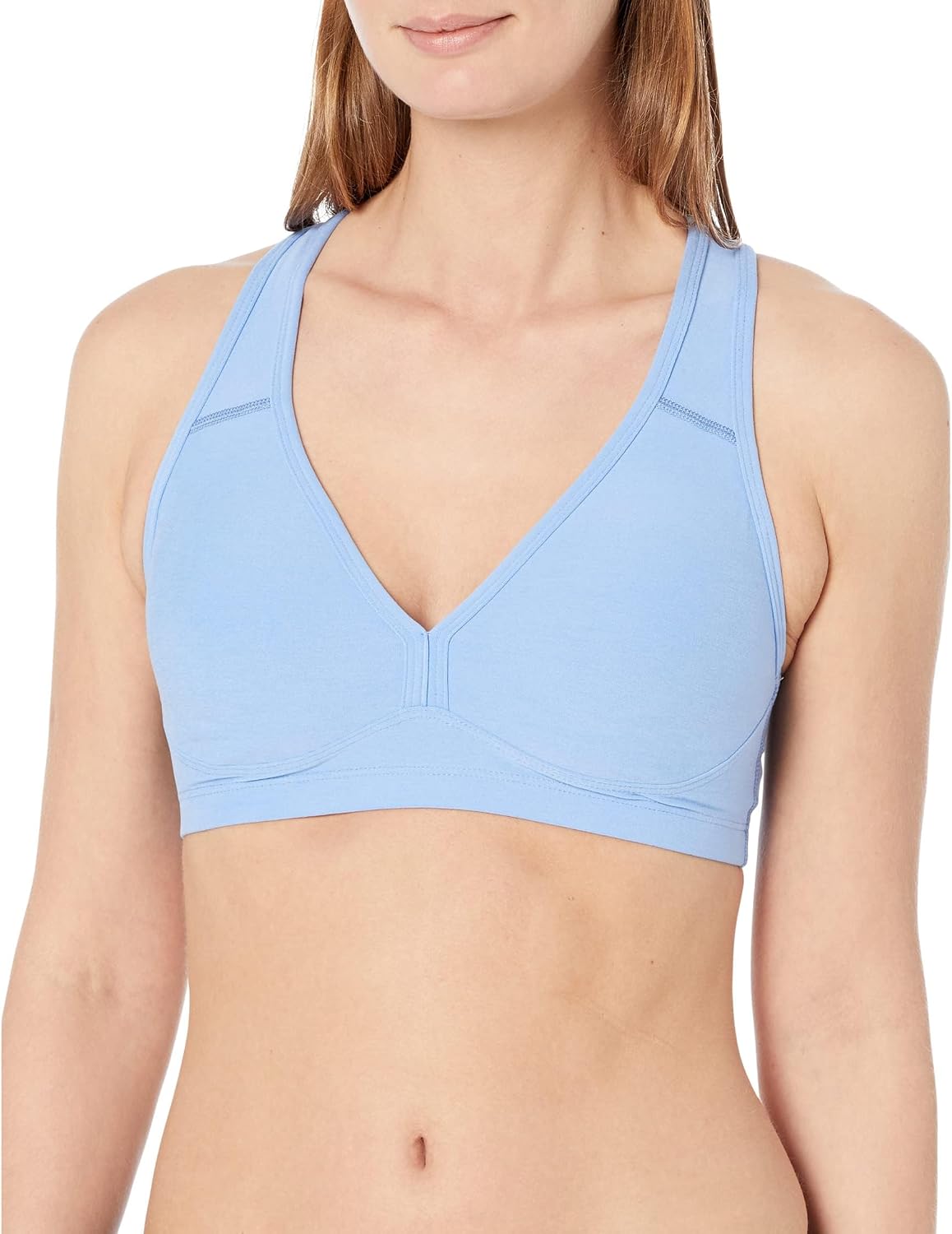 Spacedye multi-color yoga bra with fitted support, shown front view on model during yoga practice — view 4