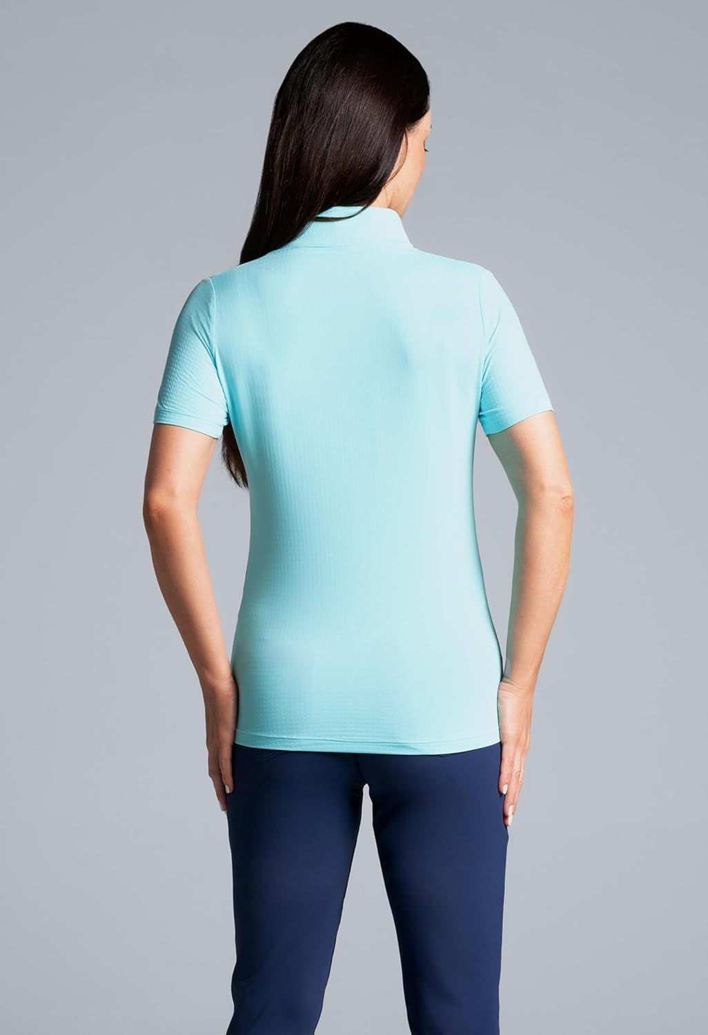 White short-sleeve mock neck top with UPF 50+ sun protection and cooling technology, front/side view — side