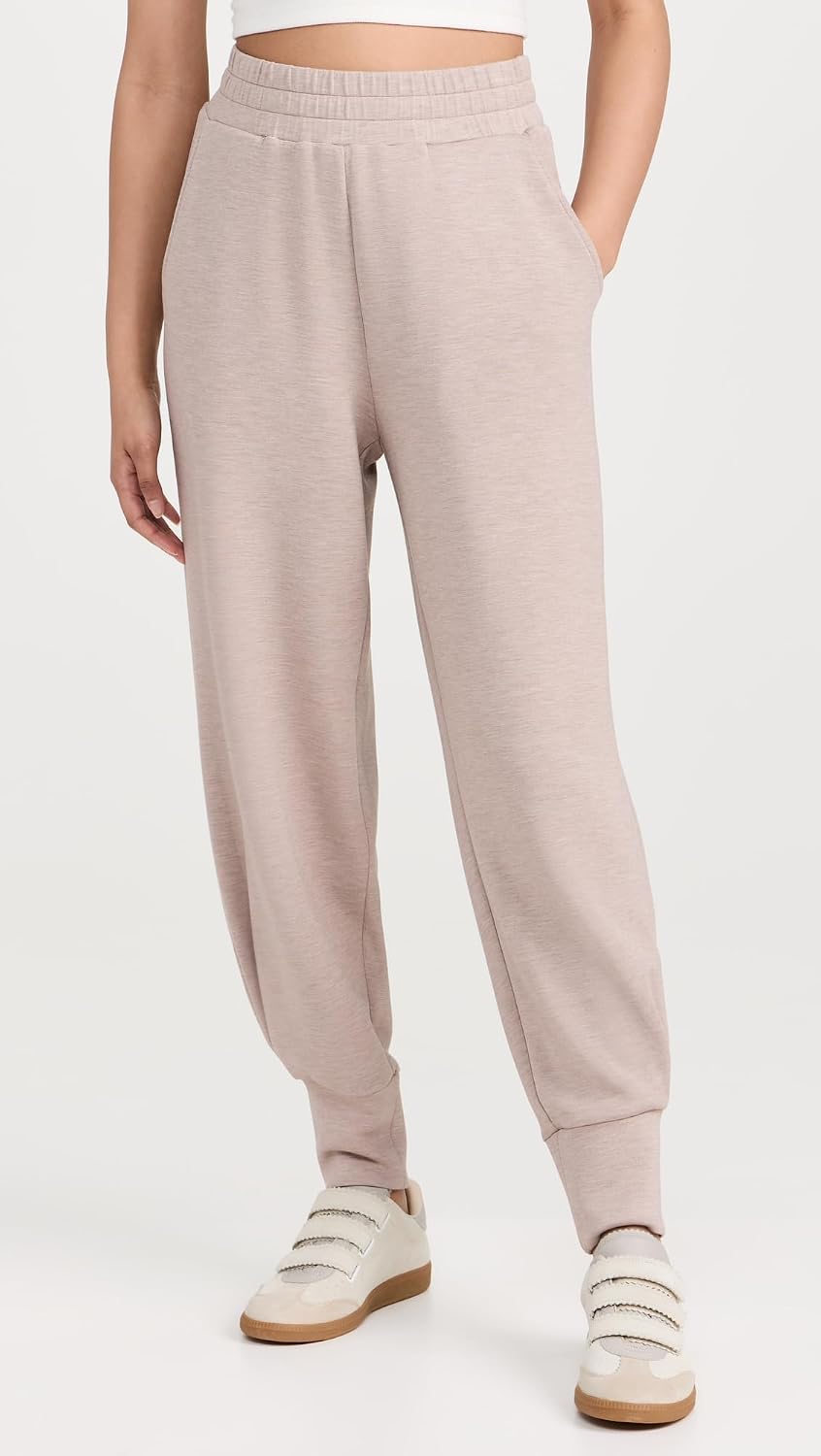 Black relaxed joggers with soft brushed fleece and moisture-wicking fabric, shown on model in athleisure setting — view 2