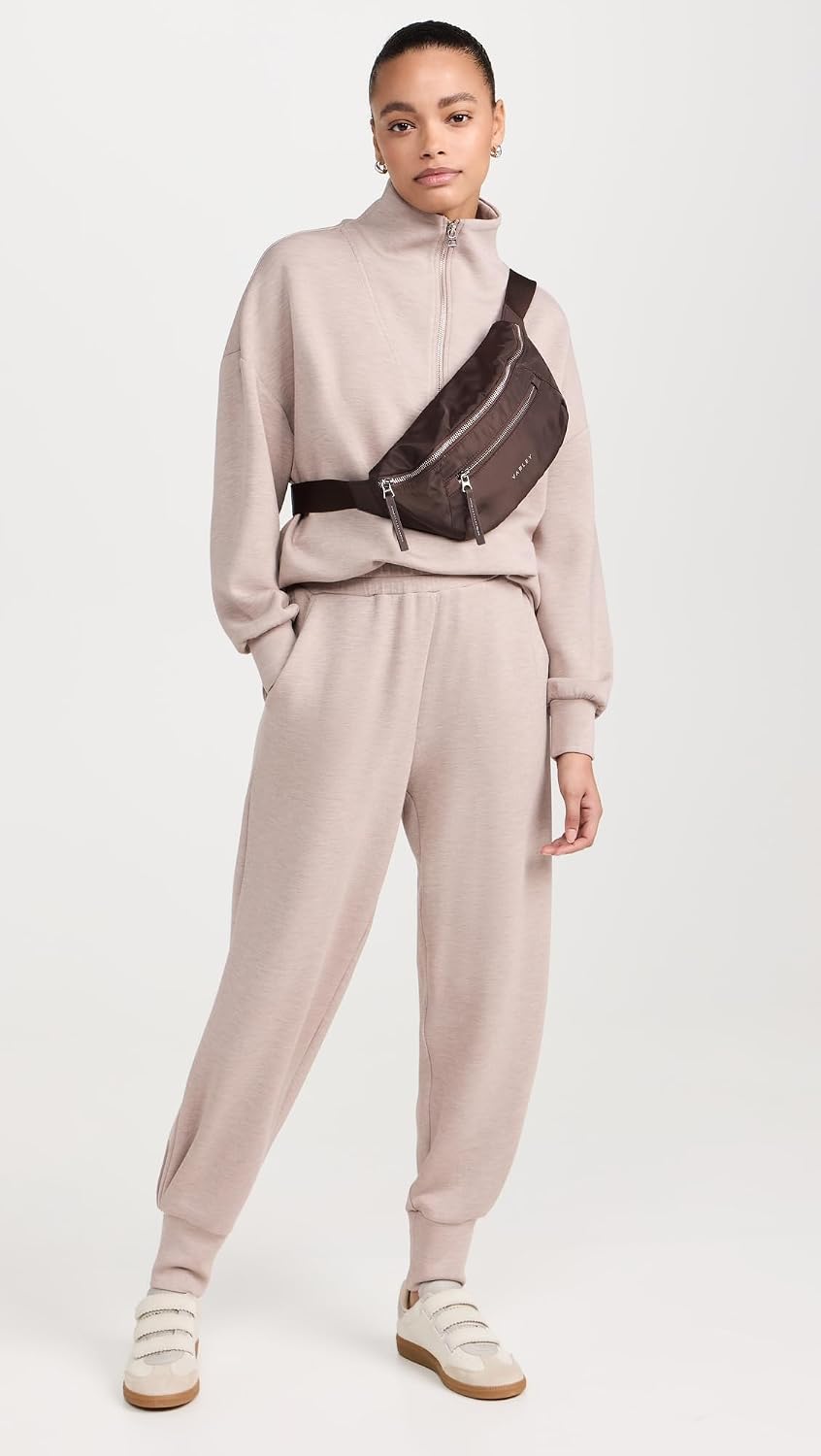 Black relaxed joggers with soft brushed fleece and moisture-wicking fabric, shown on model in athleisure setting — view 3