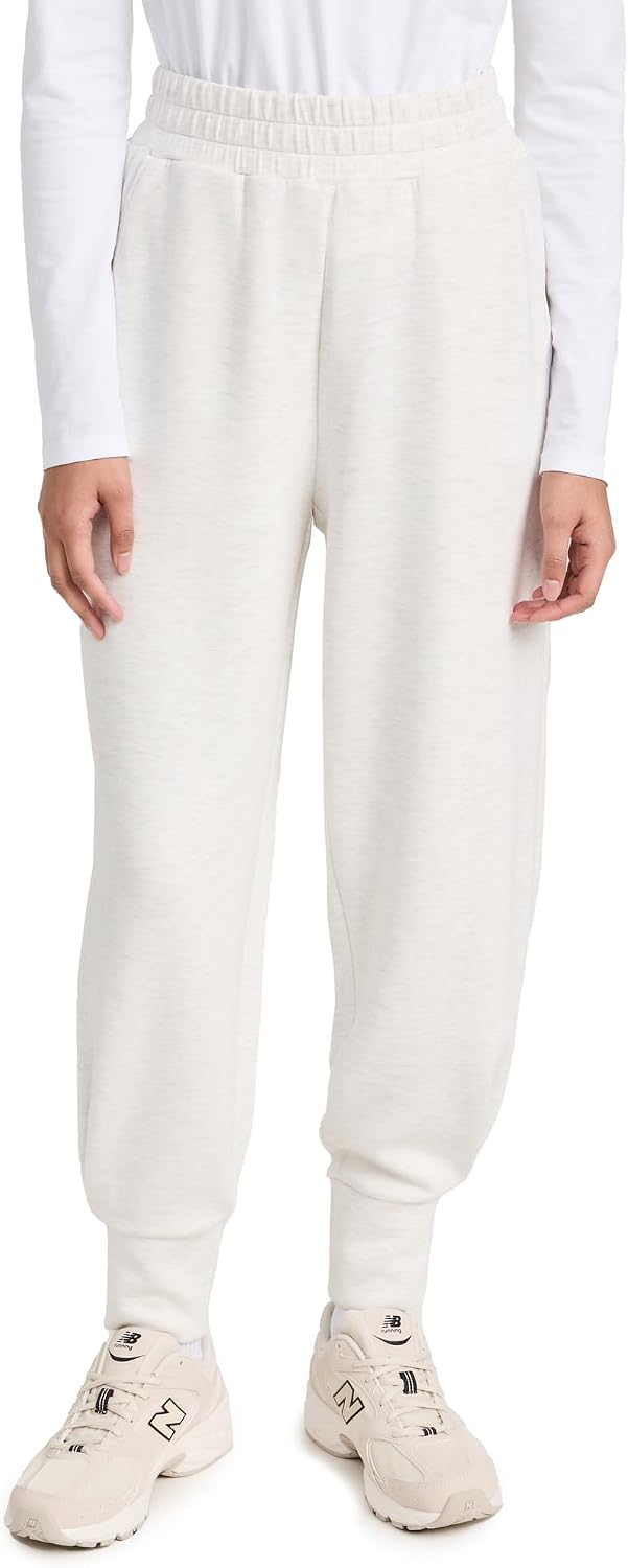 Black relaxed joggers with soft brushed fleece and moisture-wicking fabric, shown on model in athleisure setting — view 3