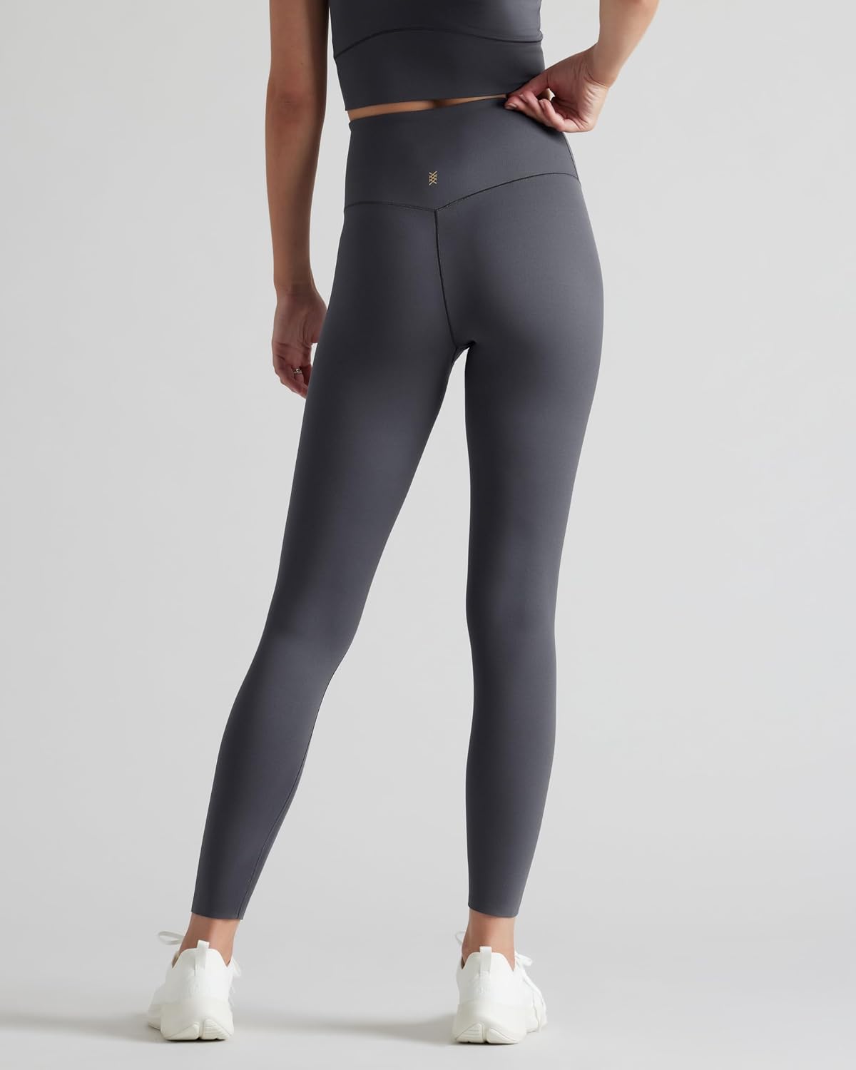 Black high-waisted 7/8 yoga leggings with moisture-wicking fabric, front view — view 4