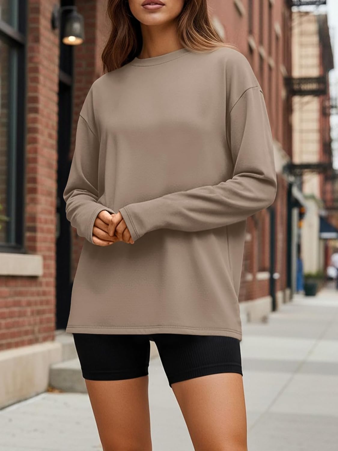 Black oversized long sleeve athleisure top with moisture-wicking fabric — side