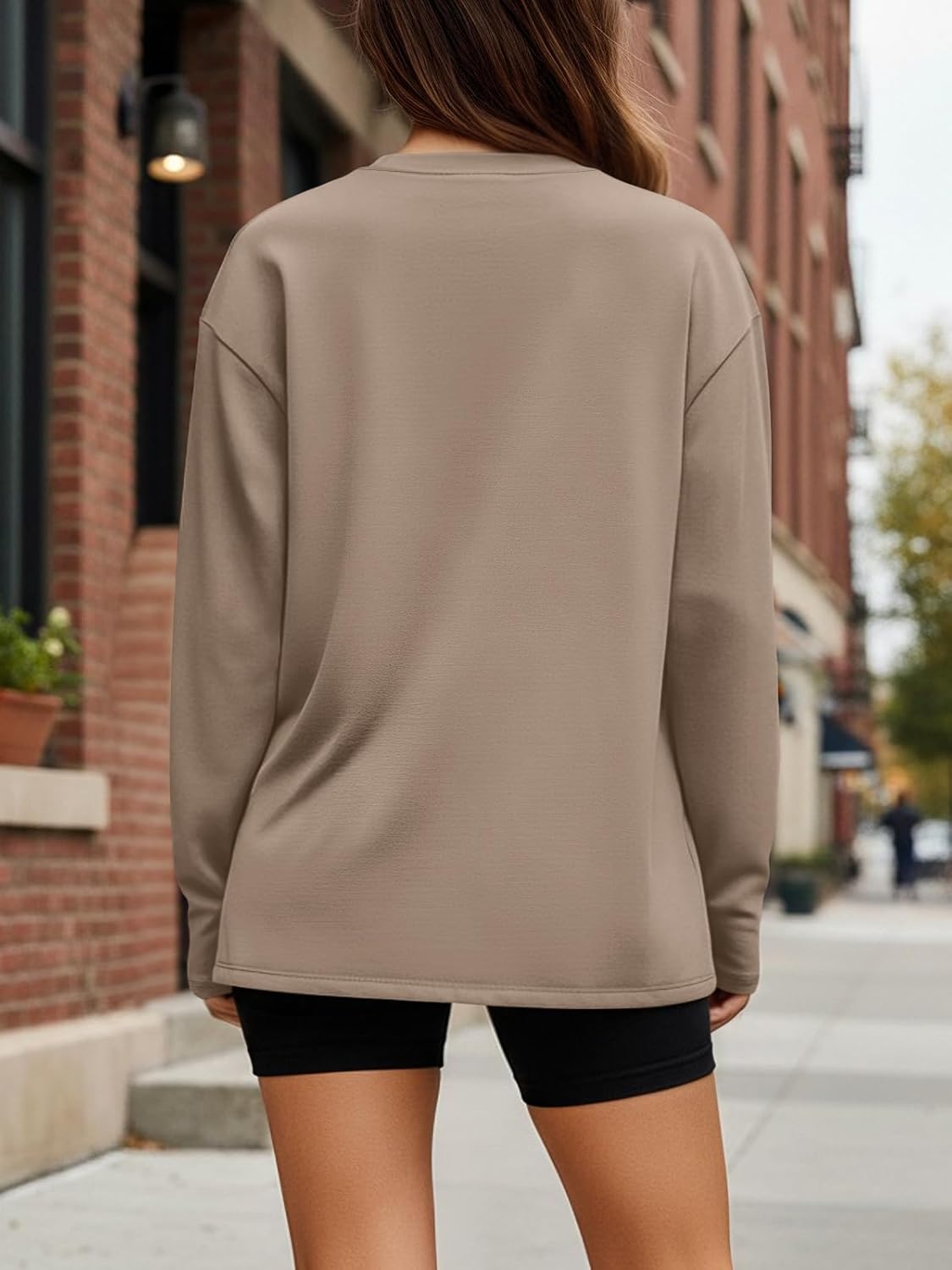 Black oversized long sleeve athleisure top with moisture-wicking fabric — detail