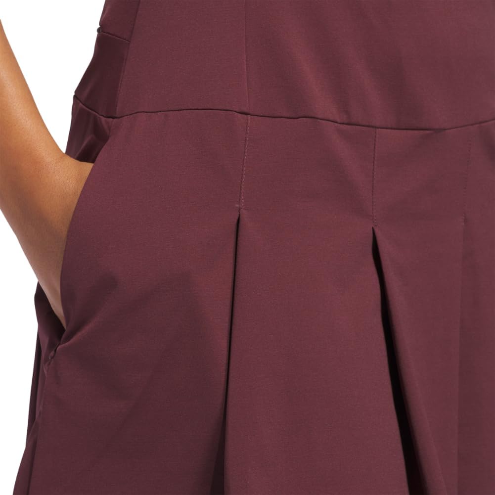 Black pleated golf dress with moisture-wicking four-way stretch fabric, front view — view 3