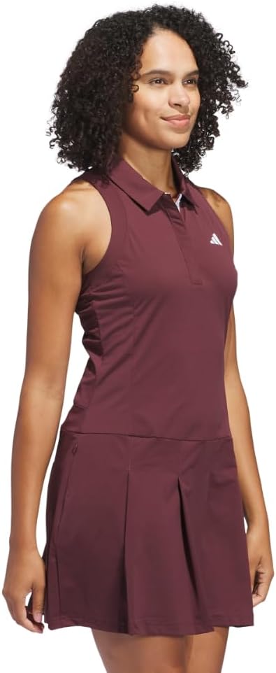 Black pleated golf dress with moisture-wicking four-way stretch fabric, front view — view 4