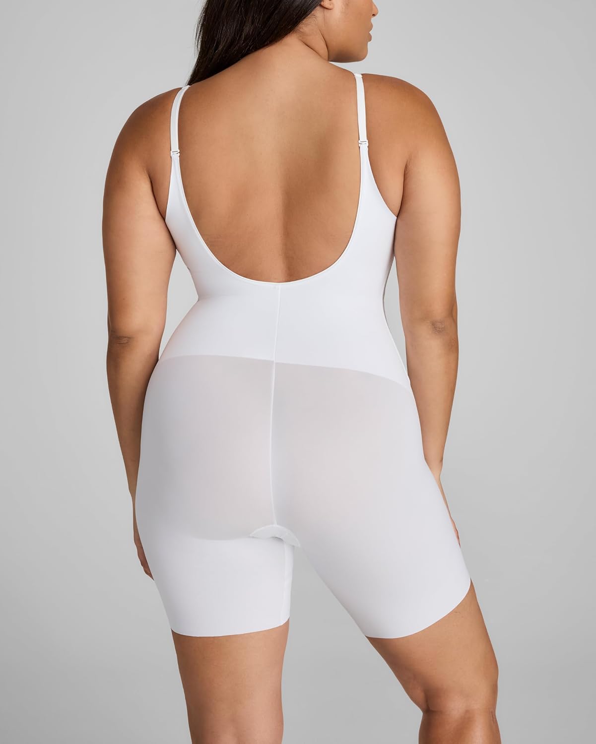 Black low-back compression bodysuit with targeted tummy control, front view on model — view 3