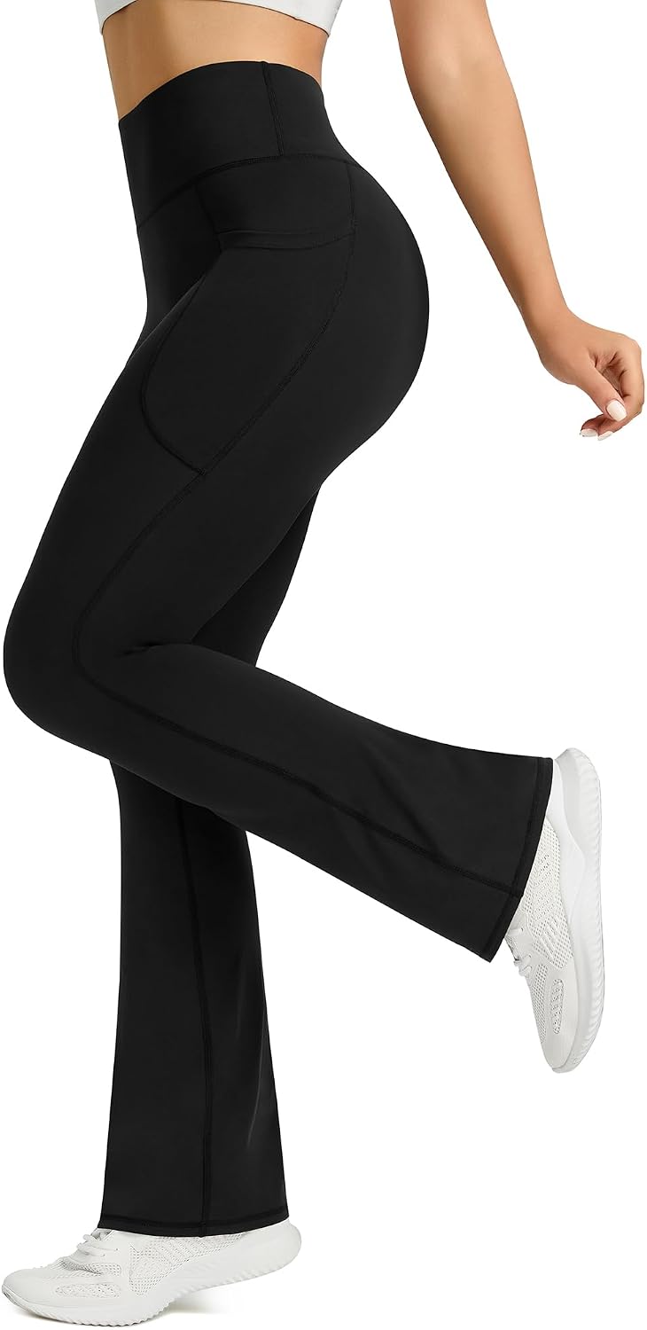Black high-waisted flare yoga pants with functional side pockets and four-way stretch fabric โ view 3